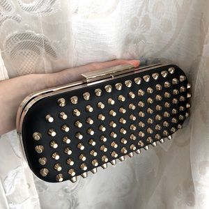 Black studded clutch